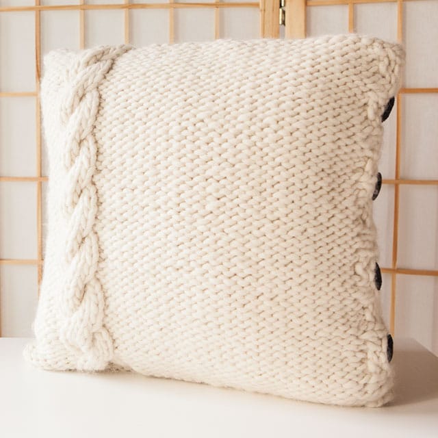 Free Cable Me Cozy Pillow Cover pattern from KnitPicks.com