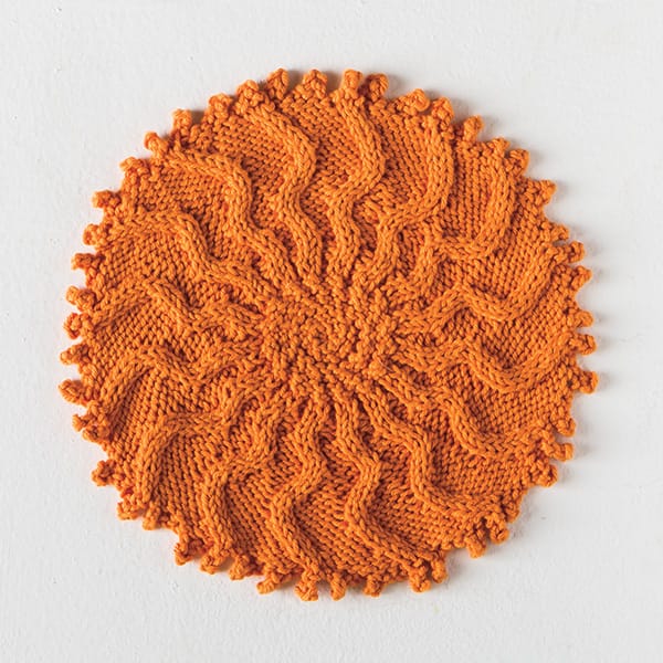 Free Cabled Sunburst Washcloth pattern from Knitpicks.com