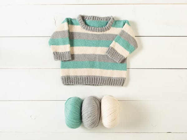 Knitted Baby Sweater in green, gray, and cream with 3 balls of Snuggle Puff Yarn by Knit Picks