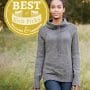 The Harley Pullover featured on the Best of Knit Picks: Pullovers and Cardigans book. A model is shown standing in a field, wearing a gray pullover sweater.