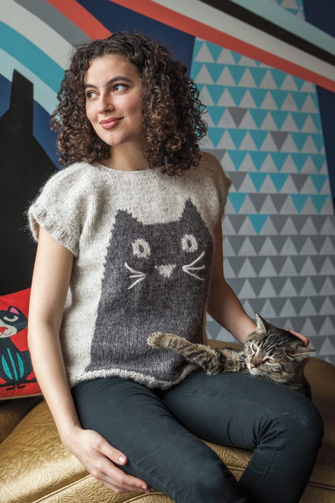 Model wearing Claire Slade's Professor Meow Pullover design