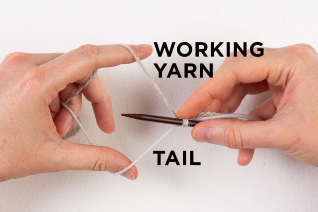 yarn set up on needle, with working yarn on top, tail yarn on bottom