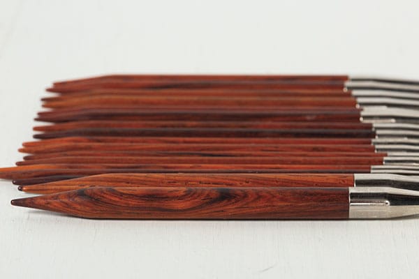 close up view of Cocobolo wooden needles