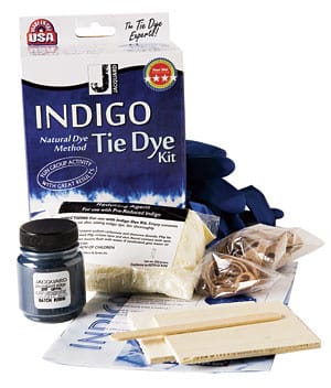 Indigo Tie Dye Kit and its contents:  indigo dye, a reducing agent, 1 pair of gloves, wood pieces, 2 sizes of rubber bands, and an instruction booklet.