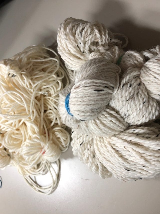 Tying a skein of bare yarn in preparation for indigo dye