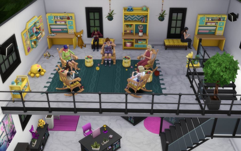 The Knit Picks Sims in their knitting area