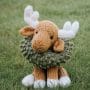 Cuddly stuffed knit Moose with a wreath around his neck