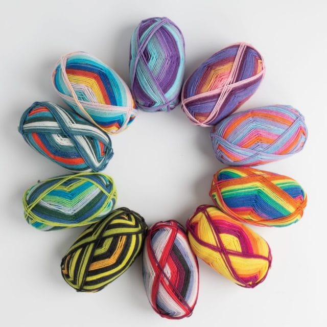 A circle of colorful Felici self-striping sock yarns