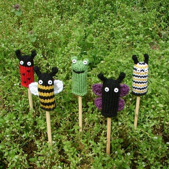Knitted finger puppets that look like animals: ladybug, bee, frog, butterfly, caterpillar